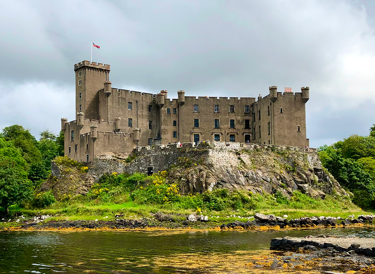 Historic stone castle on rocky shoreline