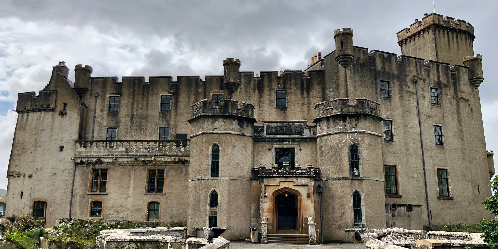 Historic stone castle with turrets and entrance