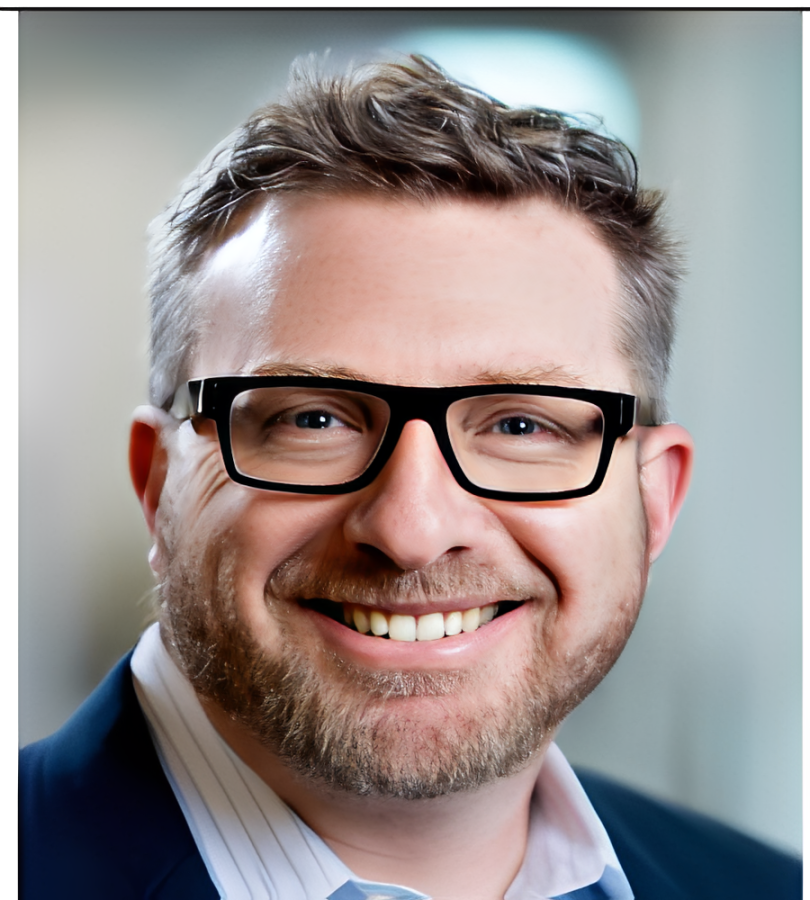 Smiling bearded man wearing glasses, business headshot