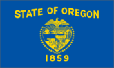 Oregon state flag with seal and year.
