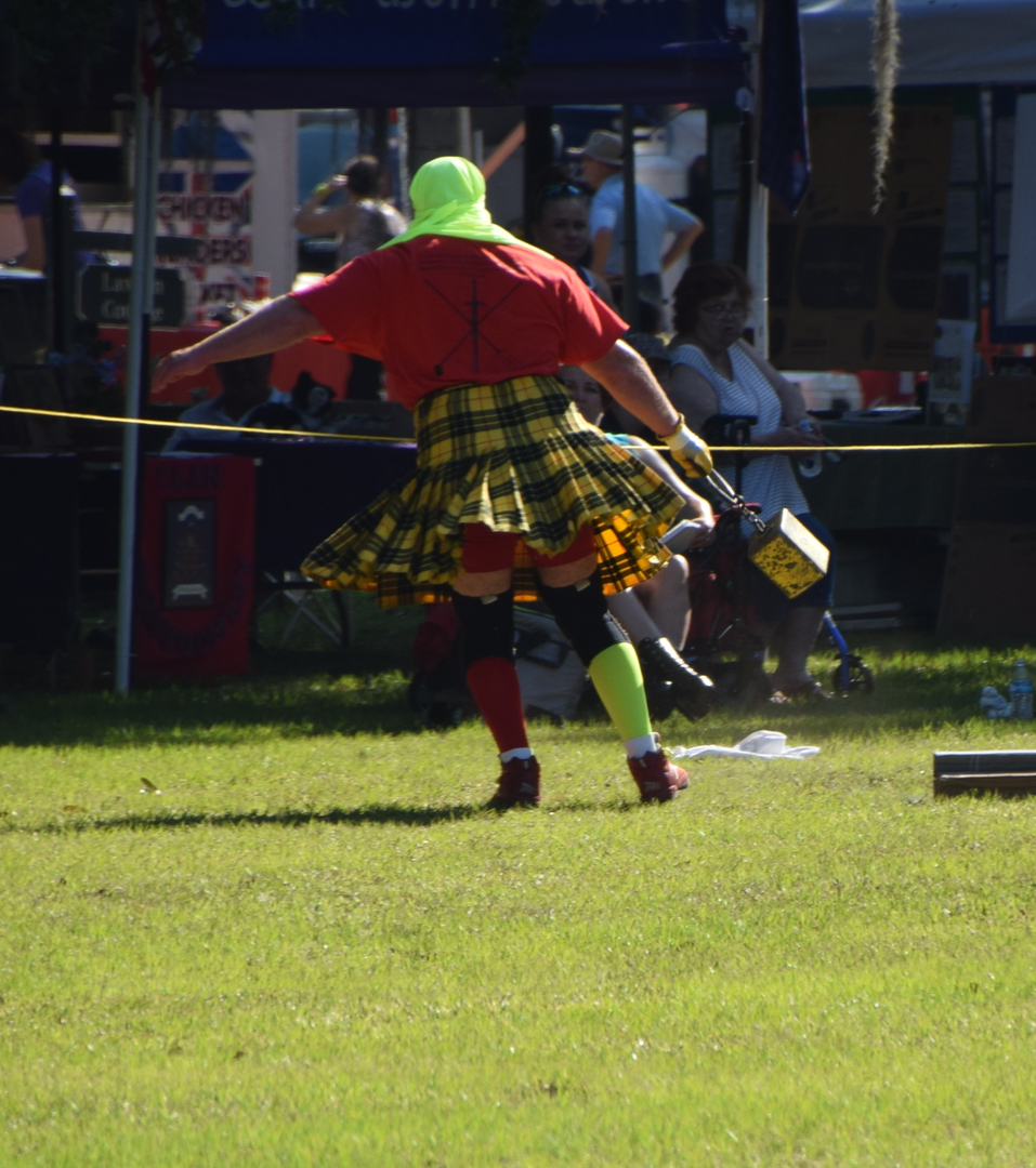 Person in colorful attire at outdoor event.