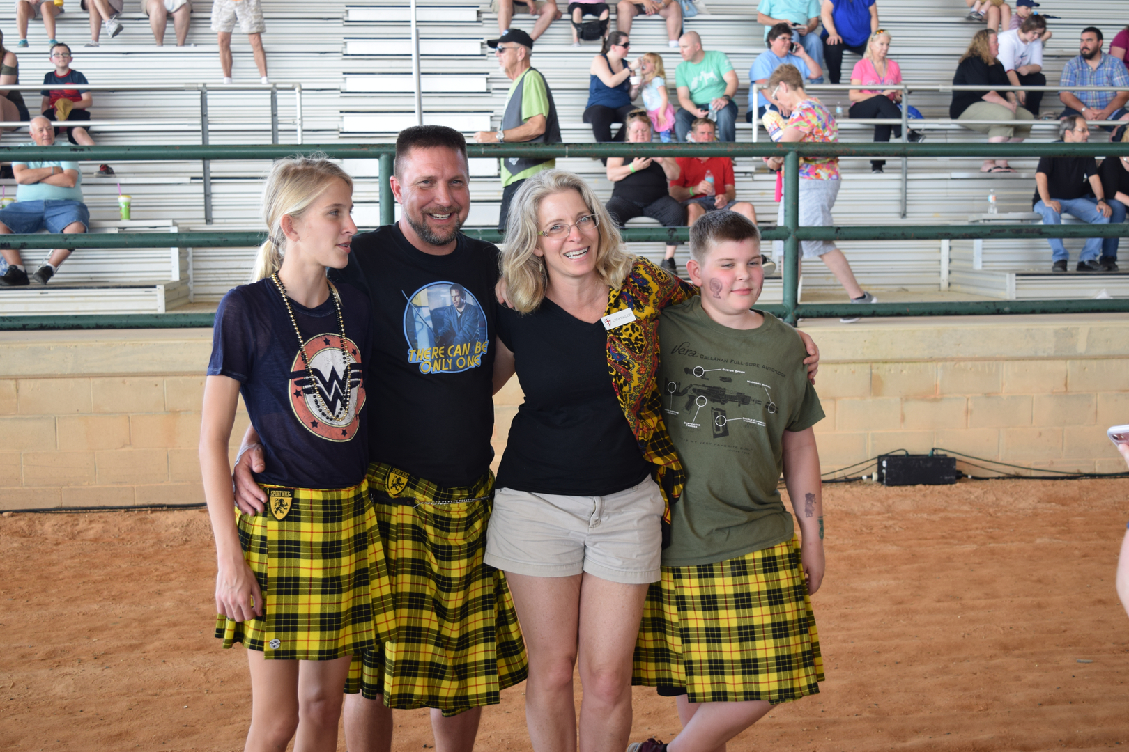 Family wearing matching yellow plaid kilts.