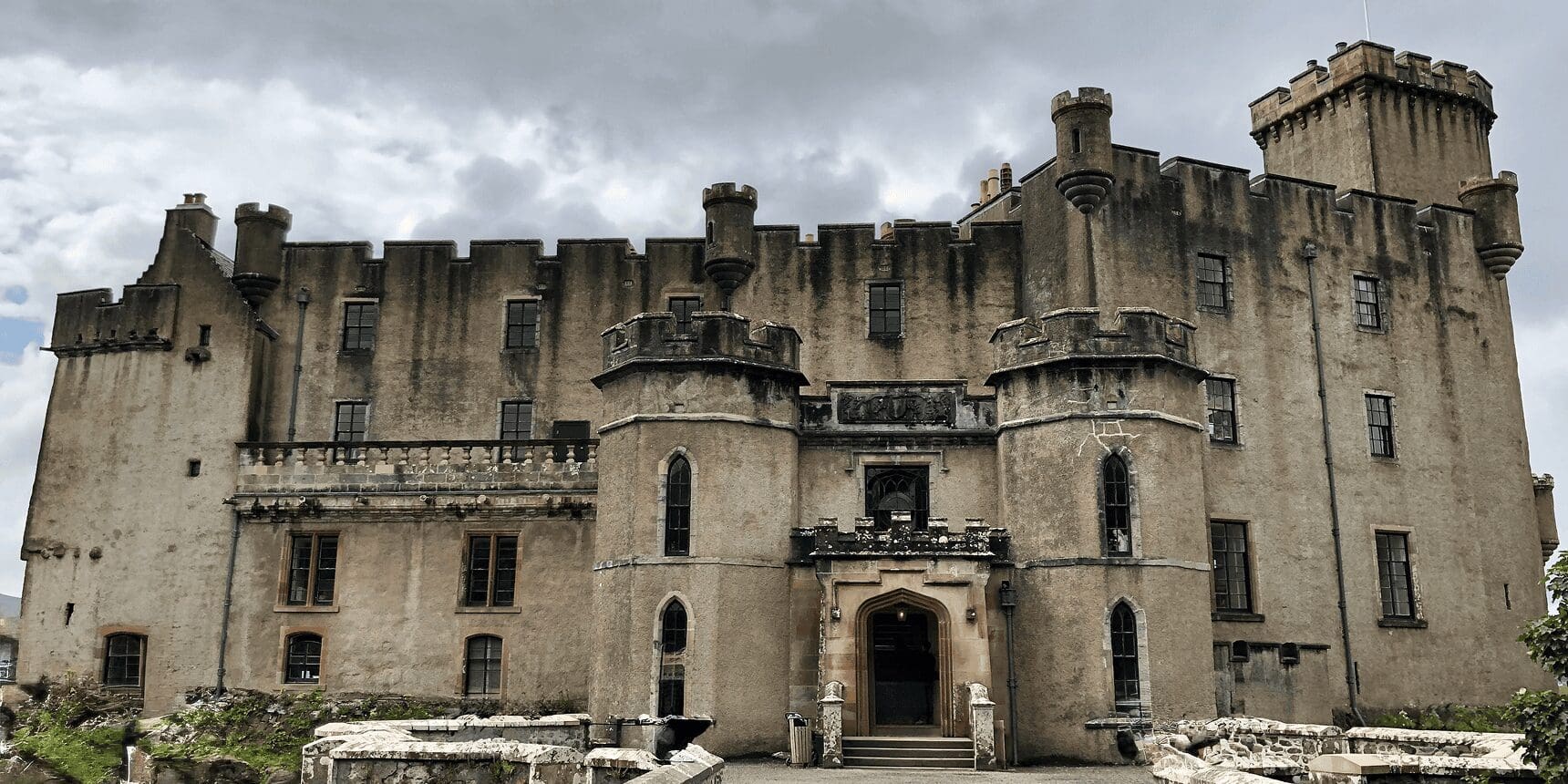 Historic stone castle with turrets and entrance