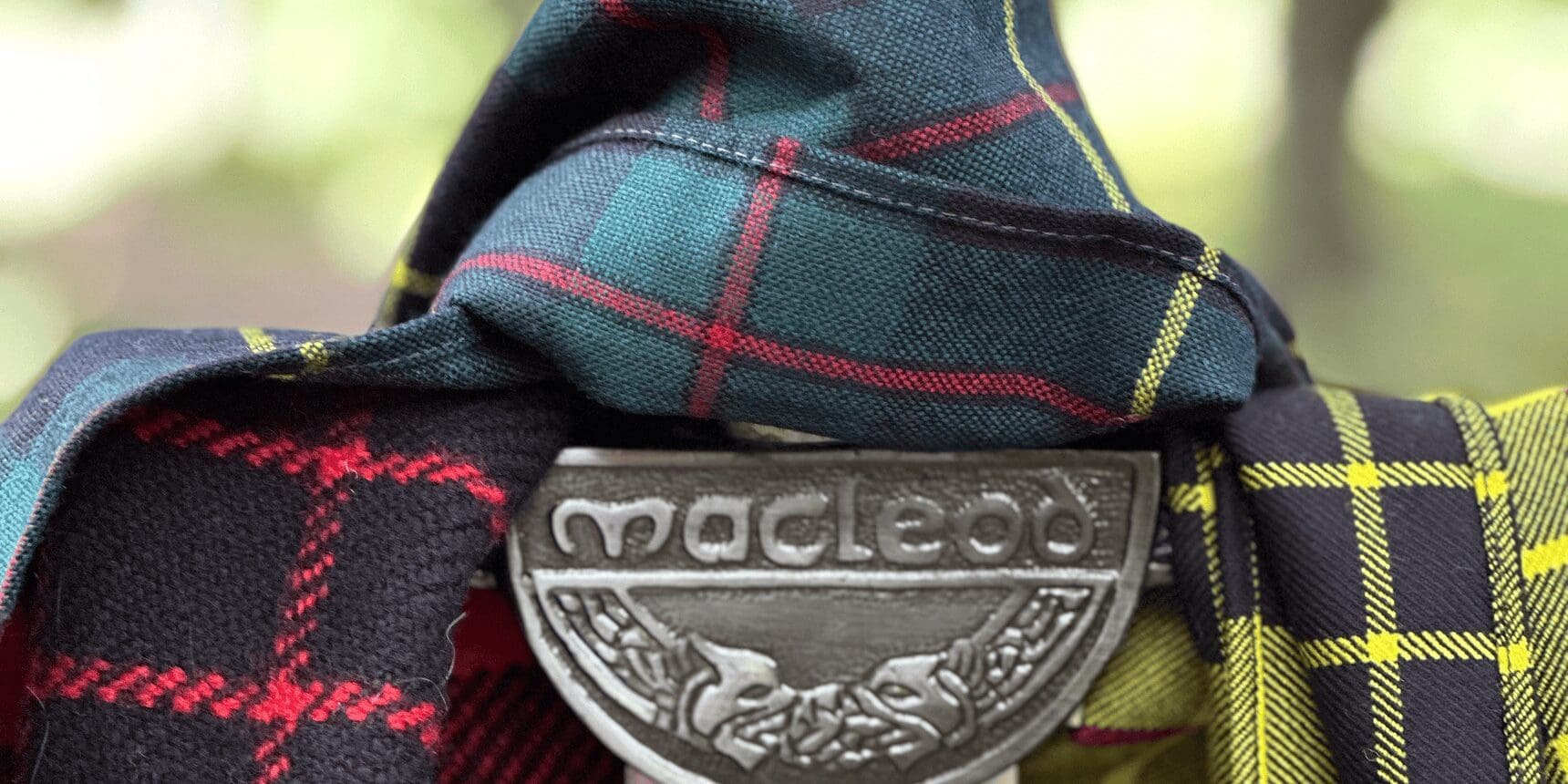 Macleod clan badge on tartan fabric