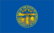 Blue Nebraska state flag with yellow seal.