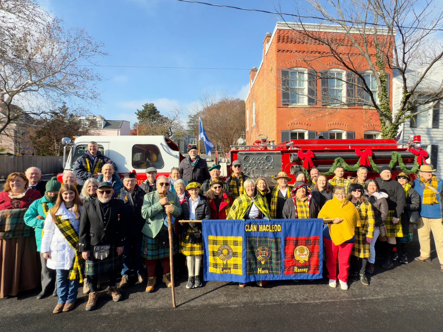 Group gathered with Clan MacLeod banner.
