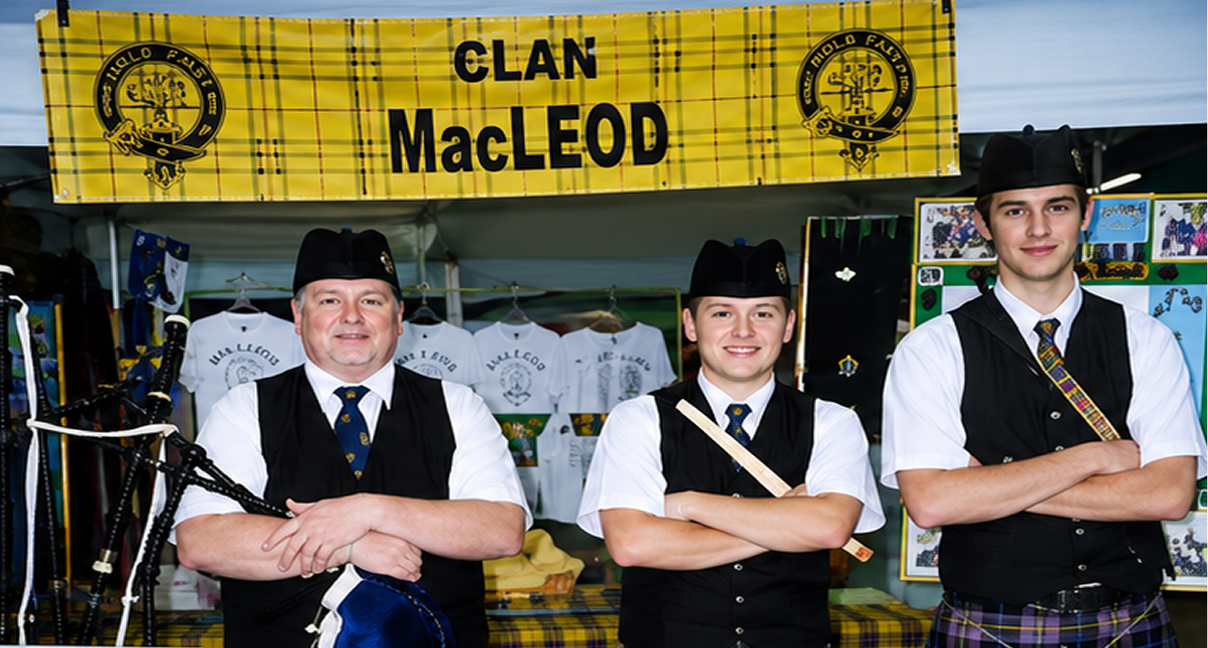 Three men in Clan MacLeod attire.