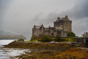 Ancient castle by a misty lakeside.