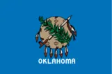 Oklahoma state flag with shield and feathers.