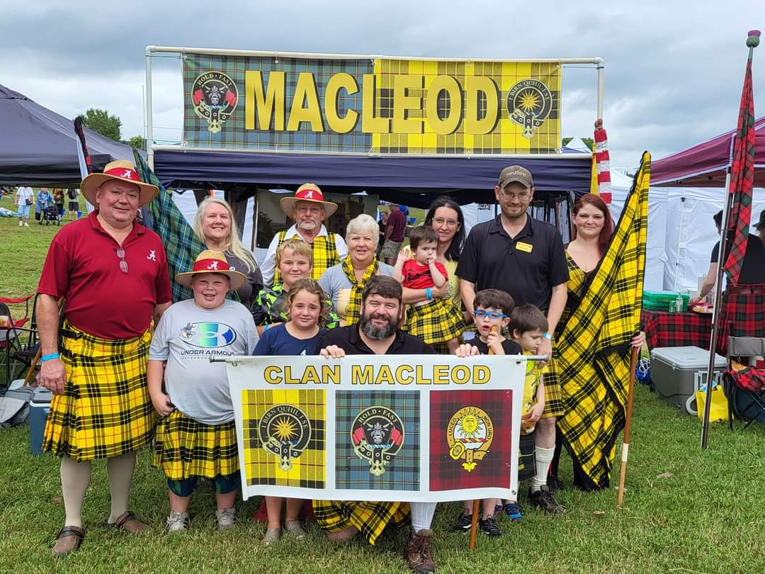 Group wearing tartans at Clan MacLeod gathering.