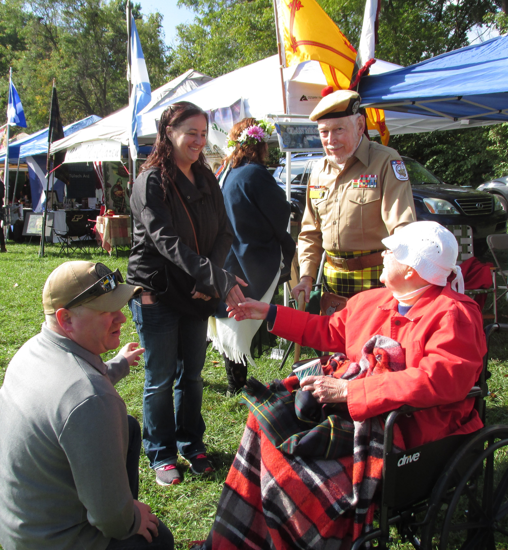 People gathered outdoors at a festive event.