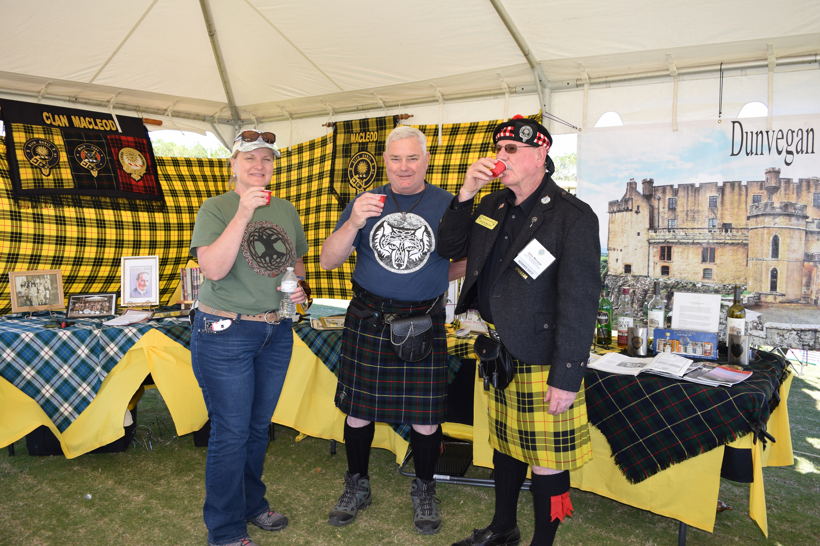 People in kilts at a Scottish festival.