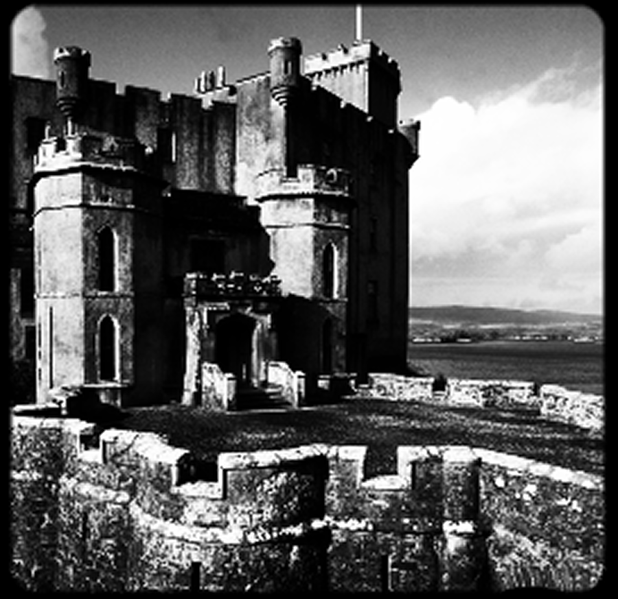 Historic stone castle overlooking a scenic landscape.